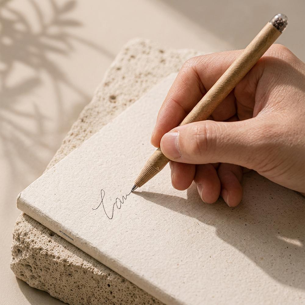 EkoScrib recycled paper pen writing on notepad